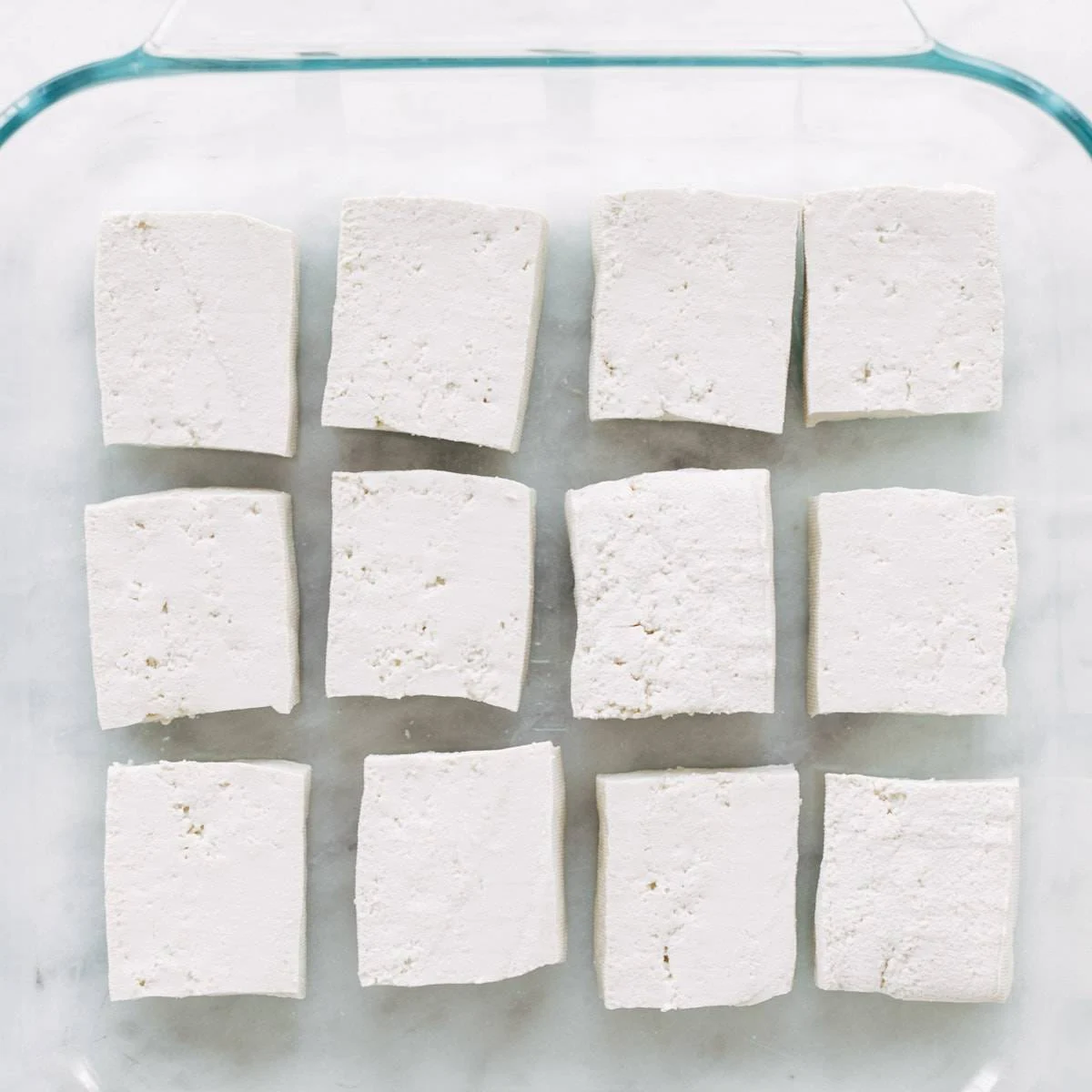 Raw tofu in glass dish