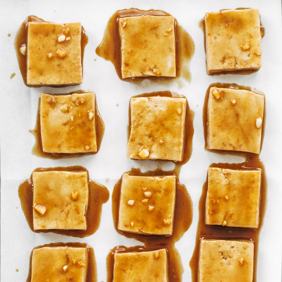 Transfer tofu to parchment lined baking sheet.