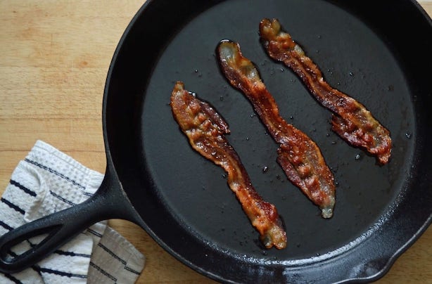 Cooking bacon on cast iron.