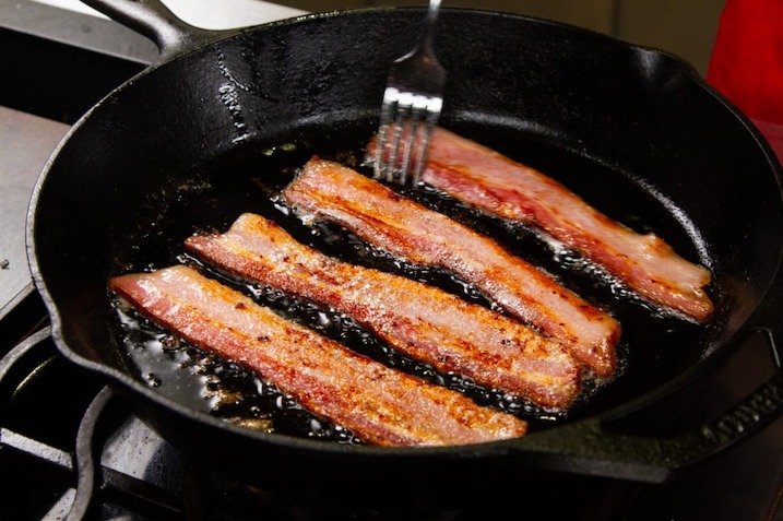 Cooking bacon strips with separation.