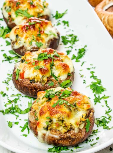 Stuffed portobello mushrooms served on plate.