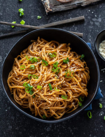 Instant Pot Garlic Noodles served with toppings.